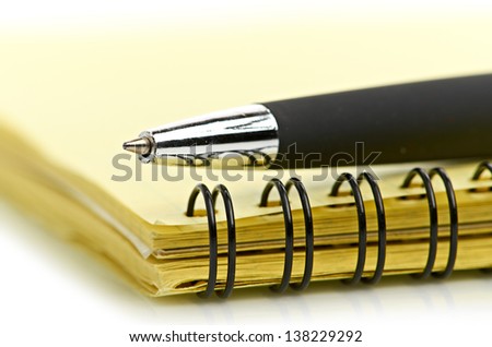 notepad and pen isolated on white background