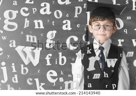 smart boy with flying letters, studio shot