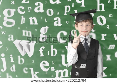 smart boy with flying letters, studio shot