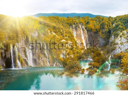 waterfall in mountain forest autumn