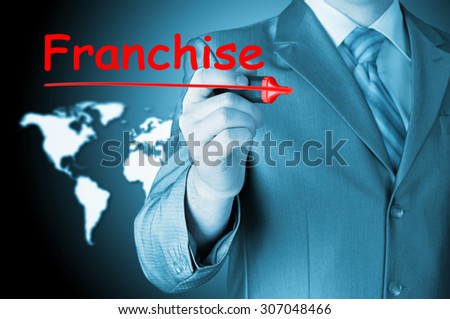 business man writing franchise