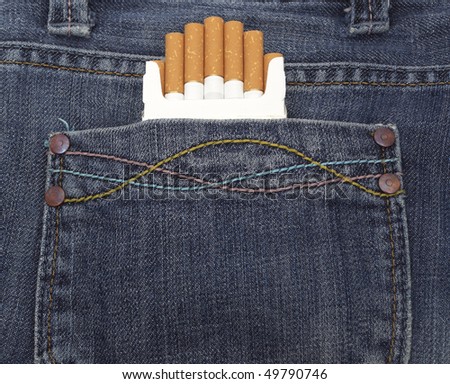 close up of a blue jeans pocket with cigarettes coming out of it