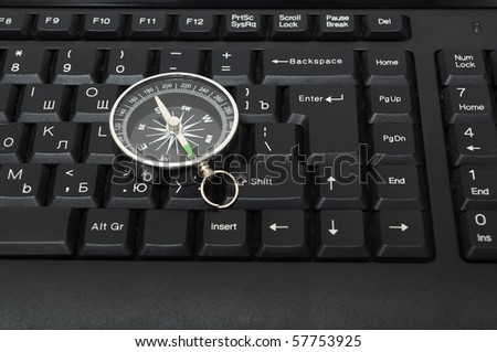 computer keyboard and compass showing internet navigation concept