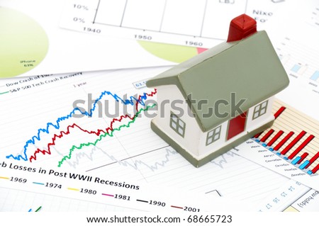 stock photo : Housing market concept image with graph and toy house housing market graph. stock photo : Housing market concept image with graph and toy house