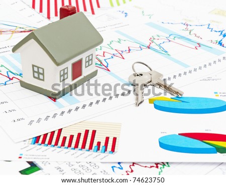 stock photo : Housing market concept image with graph and toy house housing market graph. stock photo : Housing market concept image with graph and toy house