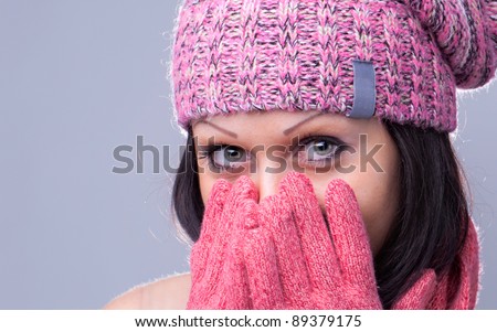 Girl with beautiful eye in rose hat and glove