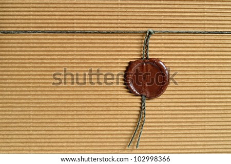 Cardboard paper background with sealing wax