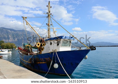 KALAMATA, GREECE - OCT 4: Fishing ship in marina of the chief port of the Messenia regional unit shown on oct 4, 2013 in Kalamata. Is the second most populous city of the Peloponnese