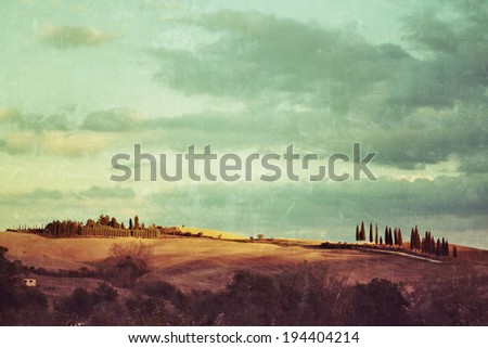 Idyllic rural Tuscan landscape with old farmhouse near Pienza at sunset, Vall d\'Orcia Italy, Europe. Filtered. Vintage effect applied