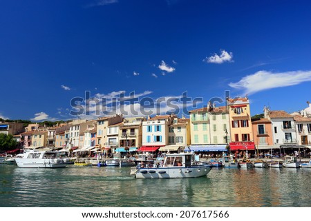 CASSIS, FRANCE - JUL R 14, 2014: A picturesque tourist port in the south of France called Cassis. Cassis is a famous port where tourists charter boats to view the calanques.