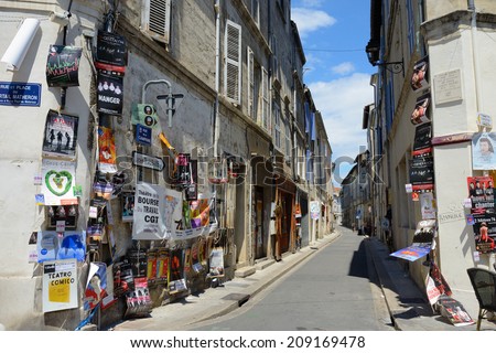 AVIGNON, FRANCE - JULY 12, 2014: Posters on the wall of street during annual Avignon Theater Festival, which in 2014 was attended around 500 theater companies in Avignon, France on July.