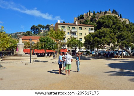 CASSIS, FRANCE - 14 JUL, 2014: Petanque players in central square of Cassis, French Riviera. Most popular game for local people in all season