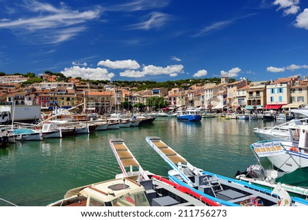 CASSIS, FRANCE - JUL R 14, 2014: A picturesque tourist port in the south of France called Cassis. Cassis is a famous port where tourists charter boats to view the calanques.