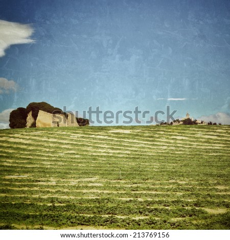 Provence landscape. Plateau de Valensole, Alpes-de-Haute-Provence, Provence-Alpes-Cote d\'Azur, France, ruin an old country house and rural field. Filtered image