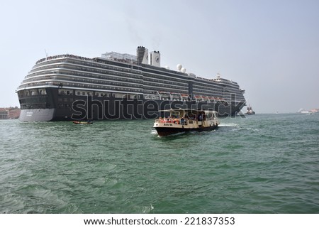 VENICE, ITALY - SEPT 21, 2014:The cruise ship crosses the Venetian Lagoon at morning. More than 10 million tourists visit Venice every year
