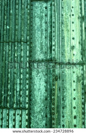 Background of copper coated with a green patina