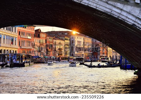 VENICE, ITALY - SEP 24, 2014: View on the Grand Canal in Venice from Rialto bridge arch at sunset. The Grand Canal is the largest canal in Venice, Italy
