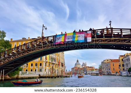 VENICE, ITALY - SEPT 27, 2014: View from Grand Canal on the Accademia bridge in Venice  at sunrise. The Grand Canal is the largest canal in Venice, Italy.