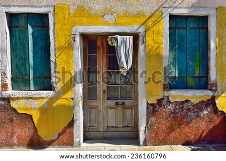 Burano island, Venice. Facade of the old house. Colorful houses island and landmark of Veneto region, Italy