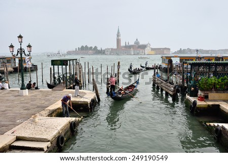 VENICE, ITALY - SEPT 21, 2014: View on the Venice San Marco seafront at early morning.Tourists from all the world enjoy the historical city of Venezia in Italy, famous UNESCO World Heritage Site