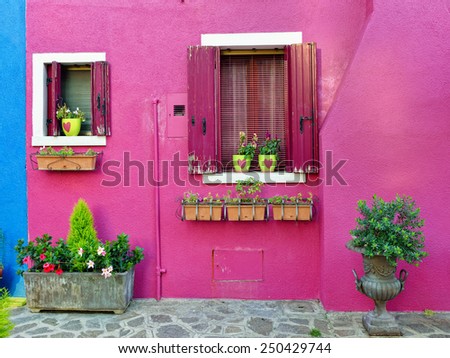 Burano island, Venice. Decorated facade of the house. Colorful houses island and landmark of Veneto region, Italy