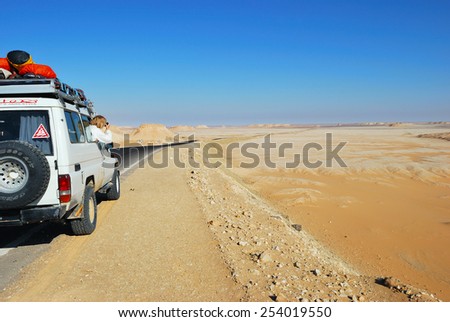 EGYPT, SAHARA - DEC 26, 2008: Off-road car shown on the road in the Tent valley desert. Extreme desert safari is one of the main local tourist attraction in Egypt