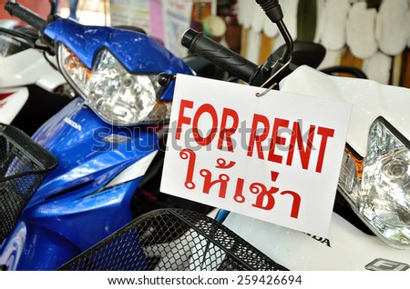 THAILAND, SAMET - DEC 25, 2011: Advertising sign plate motorbikes for rent. Motorbike is most popular and cheapest transport in Thailand