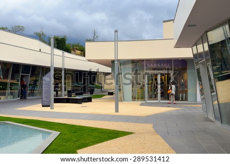 FLORENCE, ITALY - October 12, 2012: Tourists shop at Fashion Valley Outlet near Florence, Italy. Designer Outlets are located across Europe and offer discounts