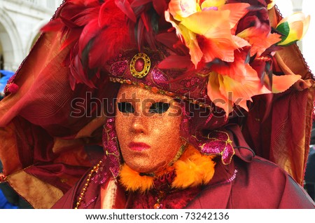 VENICE - MARCH 7: An unidentified masked person in costume in St. Mark\'s Square during the Carnival of Venice on March 7, 2011. The 2011 carnival was held from February 26th to March 8th.