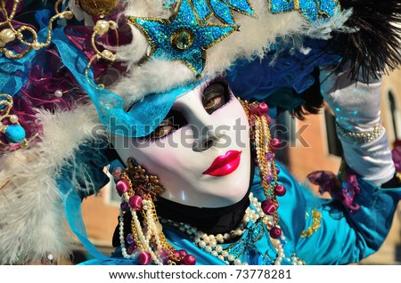 VENICE - MARCH 7: An unidentified masked person in costume on the street during the Carnival of Venice on March 7, 2011. The 2011 carnival was held from February 26th to March 8th.