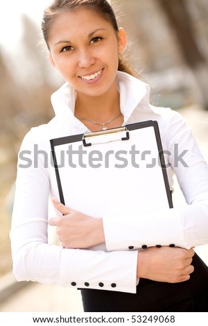 Young beautifull happy businesswoman holding folder