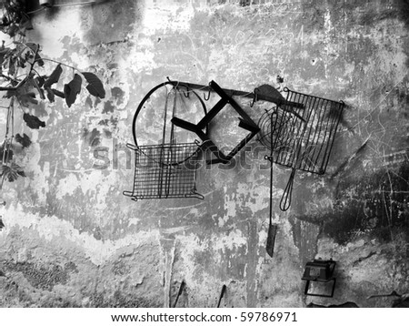 Traditional cooking tools on wall in black and white