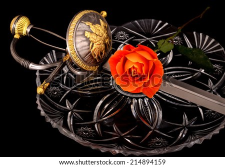Sword and rose on crystal symbolizing war and peace