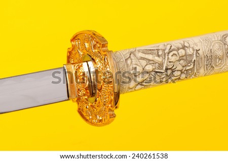 Samurai sword, Katana, Wakizashi and Tanto, isolated on yellow background