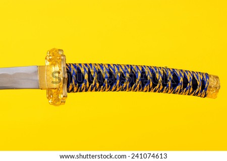 Samurai Sword, blade, guard, and hilt isolated over yellow