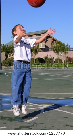 Boy catching basket ball