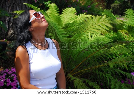 Woman gazing upward into the sun
