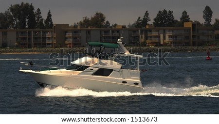 Power boat speeding across bay