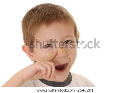 Young boy with an injury covered by a band-aid