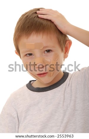 Young boy with an injury covered by a band-aid