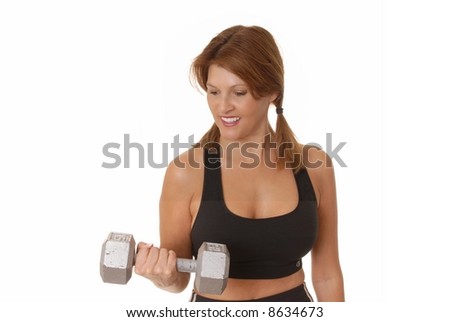 Beautiful young brunette lady doing a fitness workout