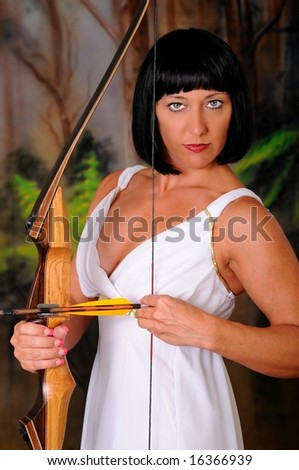 Girl dressed like a Greek Goddess holding a bow and arrow