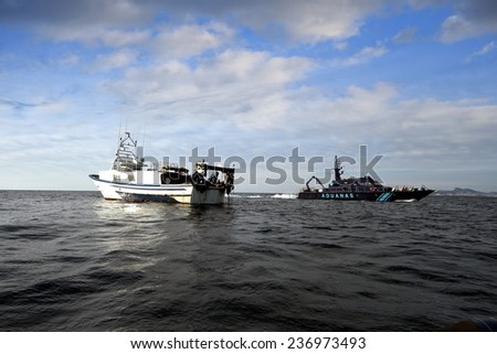 ALICANTE, SPAIN - MAY 16: A coastguard of the Spanish Customs Service makes its patrol along the coast of Altea and Calpe in the Mediterranean province of Alicante, on may 16, 2014 in Alicante.