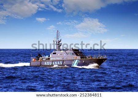ALICANTE, SPAIN - JANUARY 24: A coastguard of the Spanish Customs Service makes its patrol along the coast of Altea in the Mediterranean province of Alicante, on january 24, 2015 in Alicante.