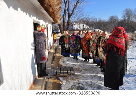 KIEV, UKRAINE - JANUARY 7: Folk Ukrainian Group celebrating Christmas Day in the orthodox churches.  Museum of Ukrainian Folk Architecture and Rural Life PYROGOVO, on January 7, 2015 Kiev, Ukraine