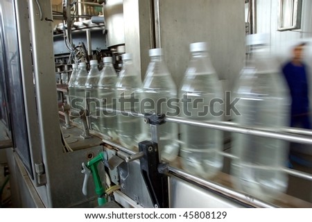 Bottles plastic The Technological line on bottling drink in plastic bottles. Conveyor automatic