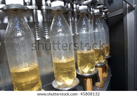 Bottles plastic The Technological line on bottling drink in plastic bottles. Conveyor automatic