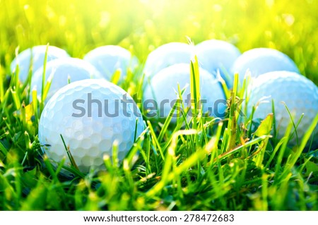 Golf game. Golf balls in grass.