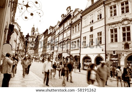 Crowd of people in streets of Prague. Sepia version.