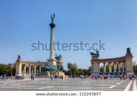 BUDAPEST - CIRCA AUGUST 2012 : Tourists visit Millennium Monument at Heroes Square circa August 2012 in Budapest, Hungary. This square has been UNESCO World Heritage site since 2002.